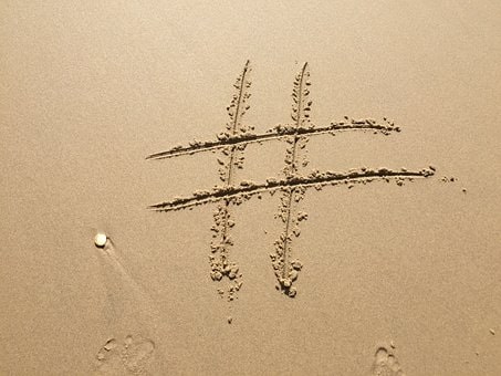 Hashtag- sand with hashtag sign carved in