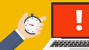 expired domain- graphics of hand holding stopwatch, laptop with red exclamation mark.