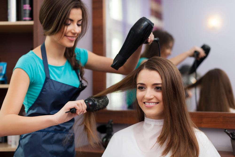 frugal living tips-skip the hair salon-image of women styling another women's hair