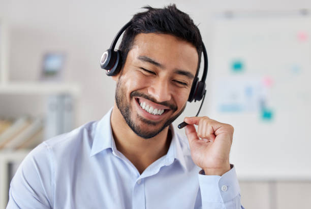 data entry-man smiling with a head set on, with a microphone
